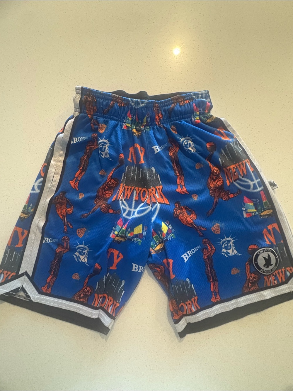Blue New York Graphic Basketball Shorts with Orange Accents